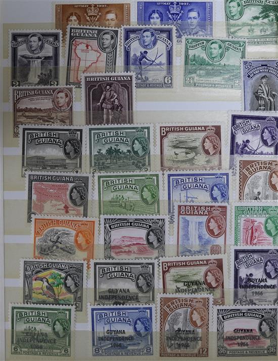 A box of All World stamps in two albums and stock books, including Imperial Ideal Album